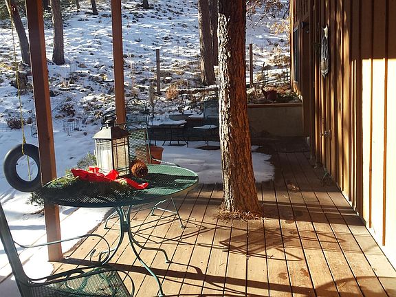Large outdoor patio furnished right outside your door. Looks into woods. Deer meander through yard daily. Fire pit and barbeque to use. Off your deck.