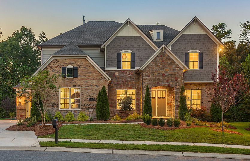 Townsend Exterior 6 features stone, brick, shakes and covered front door