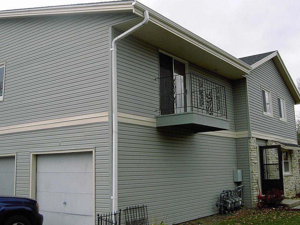 Garage & view of patio off bedroom