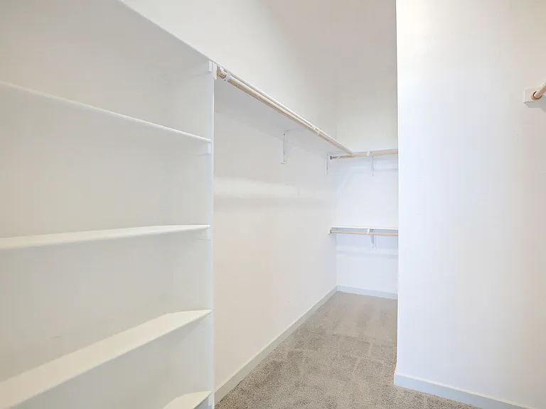 Huge walk-in closets with built-in shelves and double hanging rods mean storage is never a compromise. Garrett Harvest Junction West, Longmont, CO.