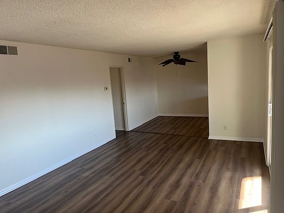 looking in from front entry to dining and door to bedrooms