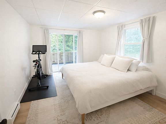 Master bedroom with slider access to screened porch