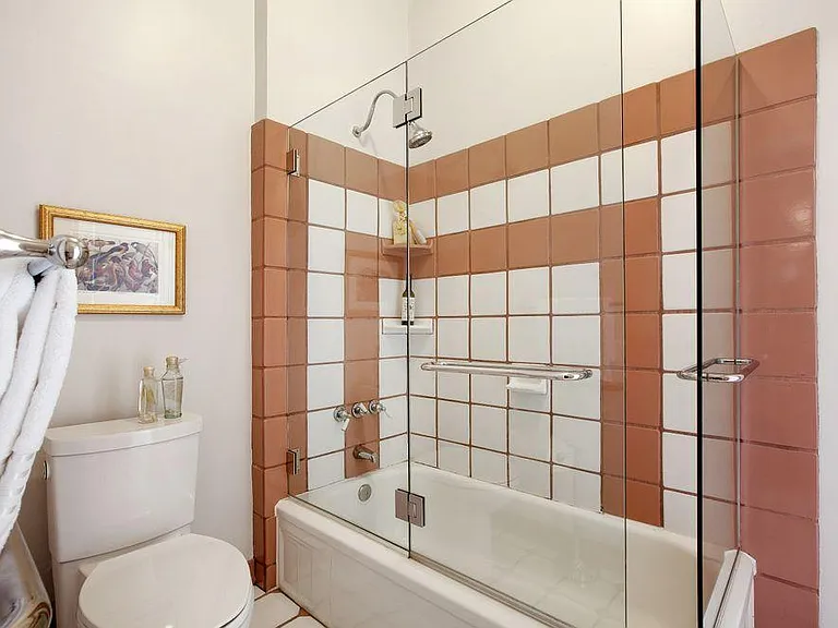 Remodeled Tiled Bathroom with Glass Shower/Tub