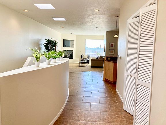 Main Floor with balcony and mountain and city views