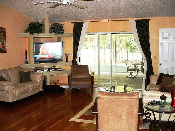 Living Room with Gorgeous floor throughout kitchen too