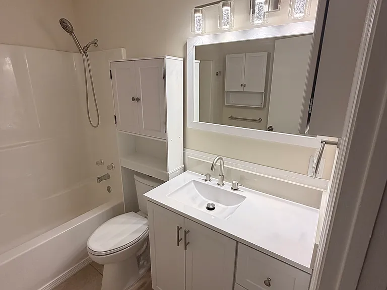 bathrooms have new toilets, medicine cabinets, vanities and lighting.