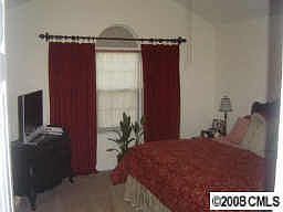 large master suite with vaulted ceiling