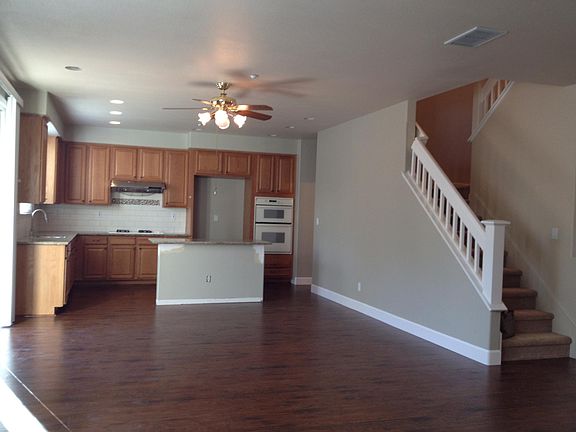 Family room looking into Kitchen (before painting was finished. Appliances are now high-end stainless appliances.