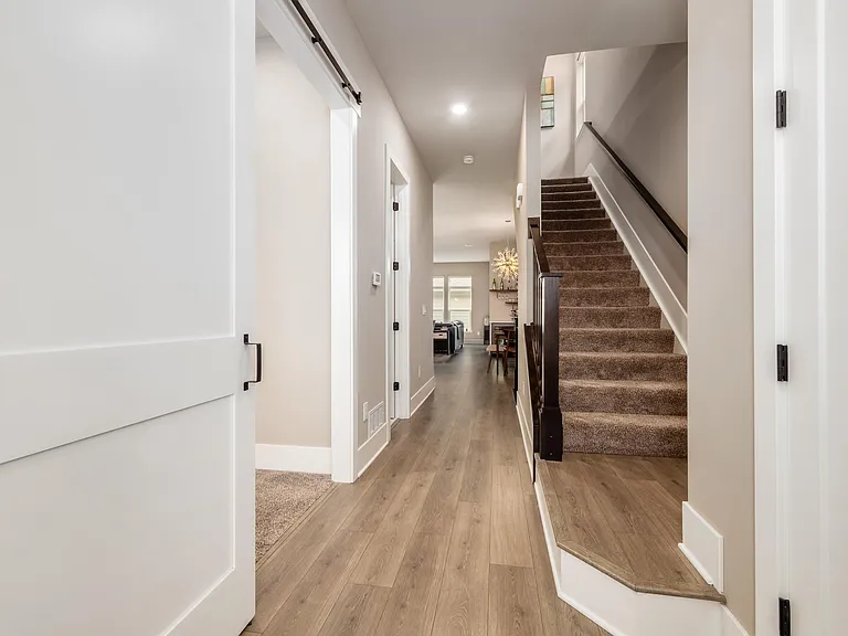 Foyer with barn door to office/bedroom on the left