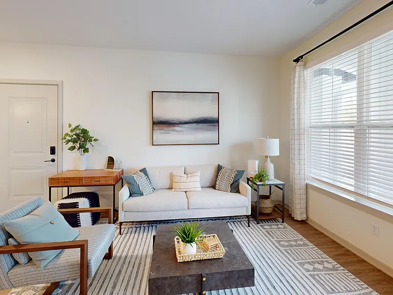 Nese Apartments feature open-concept floor plans with airy living rooms. Nese Apartments feature open-concept floor plans with airy living rooms.