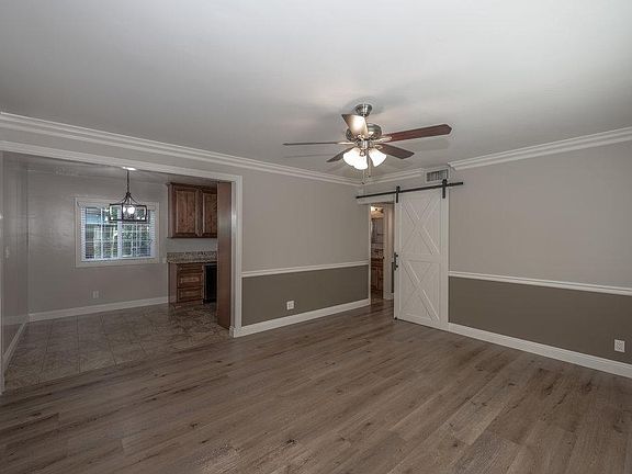 View of living room/dining area as seen from the front door