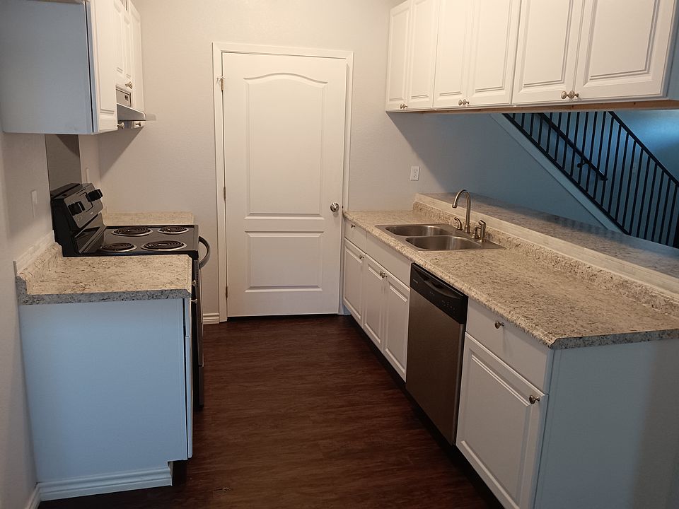 View of kitchen and doorway into laundry area.