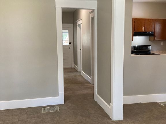 Front Door View: Living Room, Hall, Kitchen