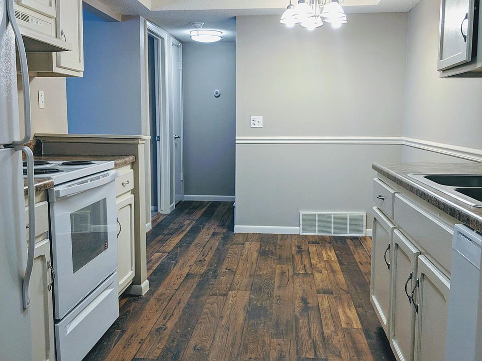 Walk through kitchen with brand new oven and dishwasher