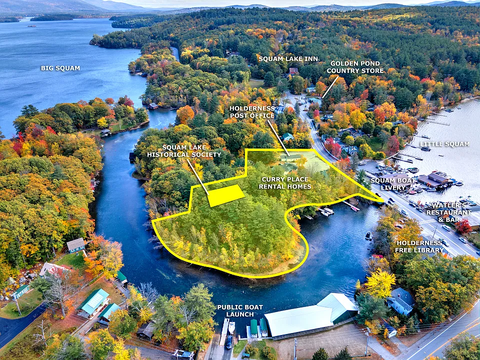 Arial view of entire 3 acre property, including a walking bath and benches along the shore