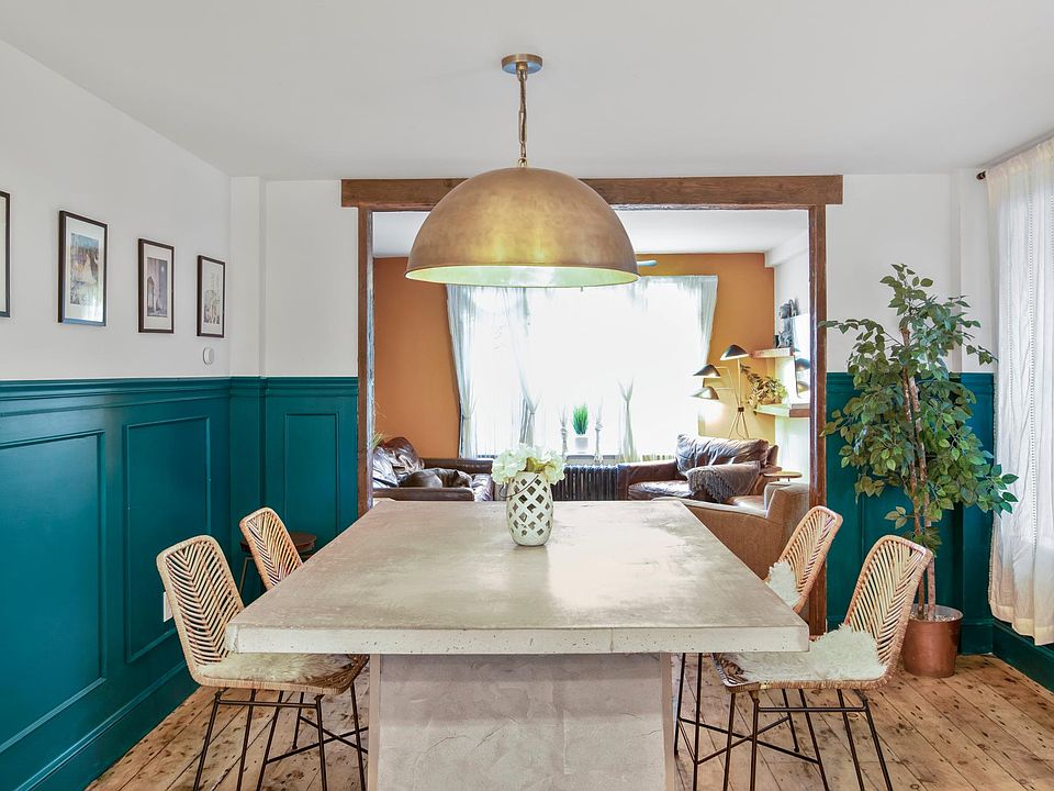 Large concrete island dinning room/kitchen looking into living room