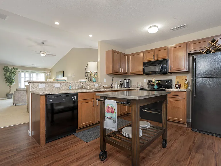 Explore your culinary dreams with our updated kitchen with wooden cabinets.