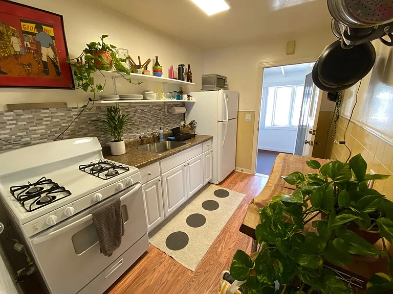 Kitchen has been updated with new lighting, floors and stove hood.