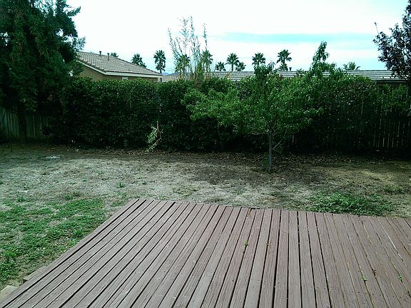 large backyard w wooden deck