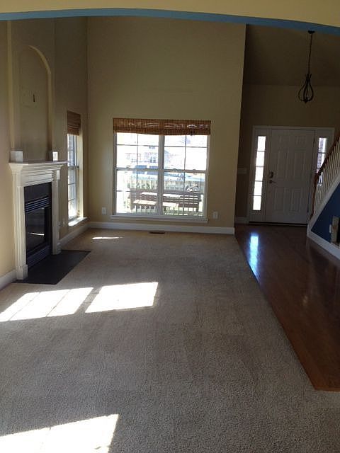 A view of the great room and entry from the dining room