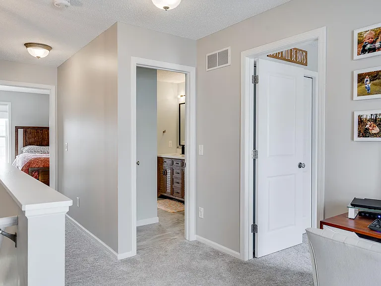 upper floor view from the open loft area - master suite, bathroom, and 2nd bathroom.