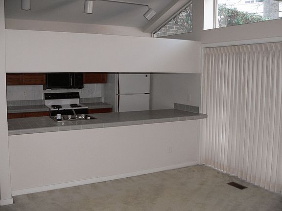 Open eating bar and kitchen before floors replaced