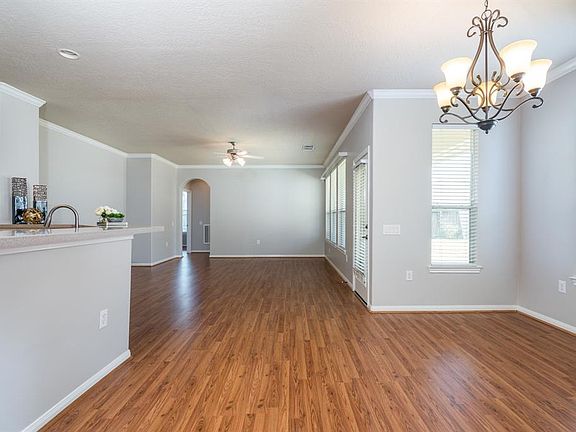 Step inside and feel the spaciousness and warmth of this wonderful patio home! Ceramic tile entry, laminate flooring, crown molding and archways are just a few of the fabulous features!
