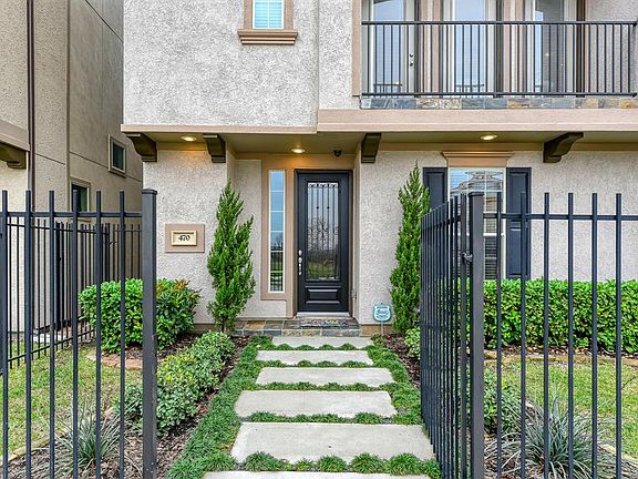 The gated front yard welcomes visitors to your new home. The front door faces northeast.