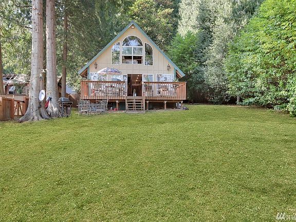 This charming waterfront home is a tranquil retreat.