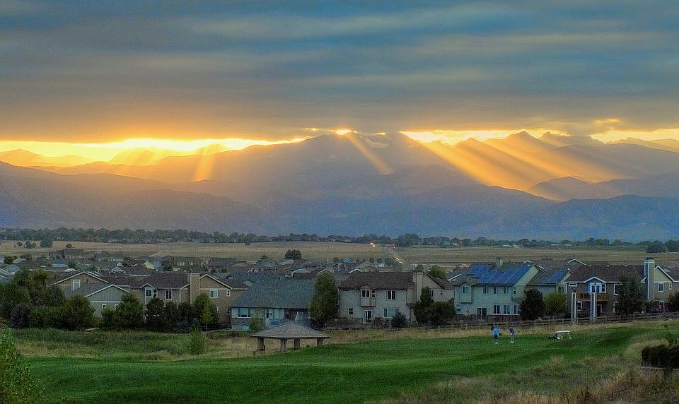 View of golfers at sunset 