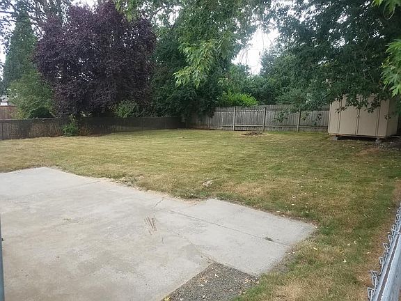 Back partially fenced yard