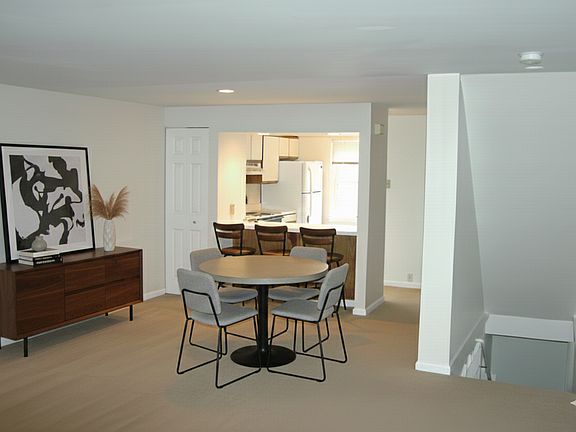 Dining Room Area w/ Breakfast Bar. FURNISHINGS NOT INCLUDED