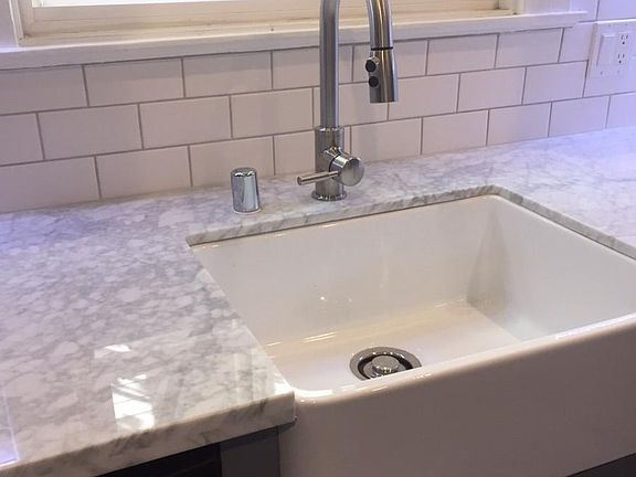 Marble countertops and farmhouse sink
