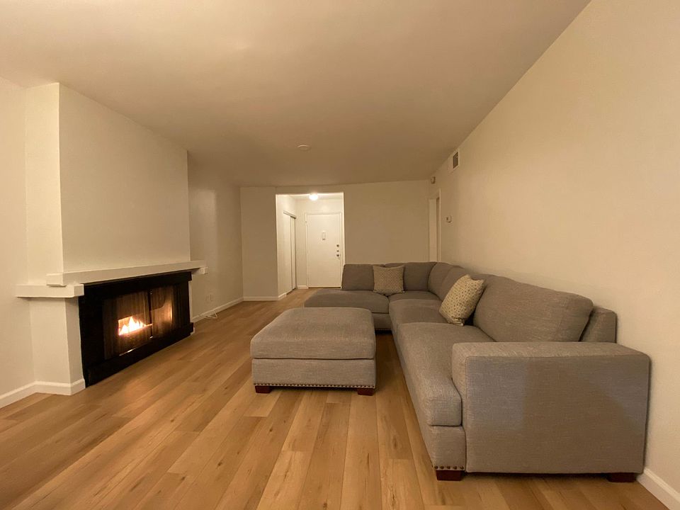 Living room with fireplace (furnishings not included).