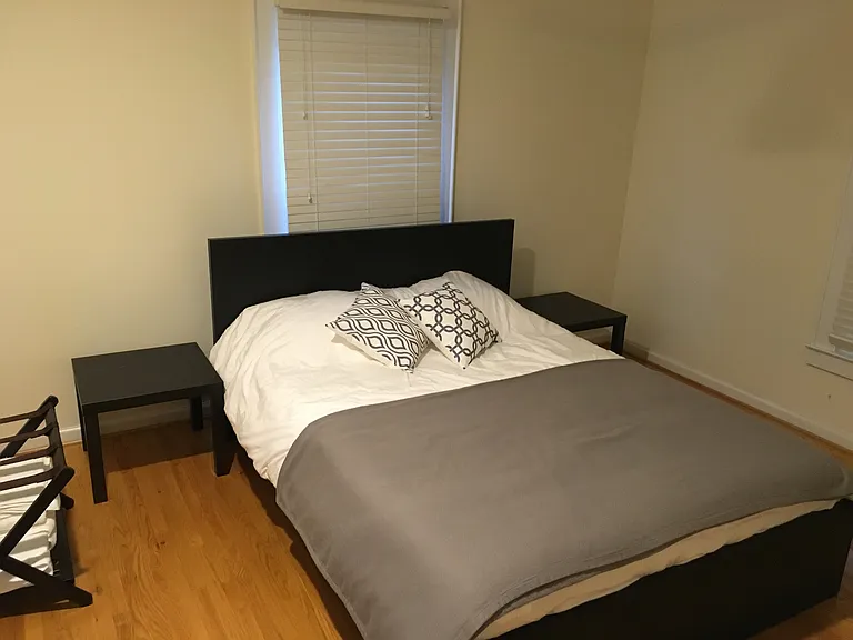 Second bedroom shown with a queen bed (house will be unfurnished). Closet to the right out of view.