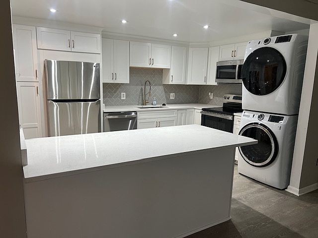 View of Kitchen from living room. Open kitchen with island.