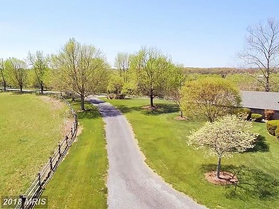 Long Tree Lined Driveway to Home