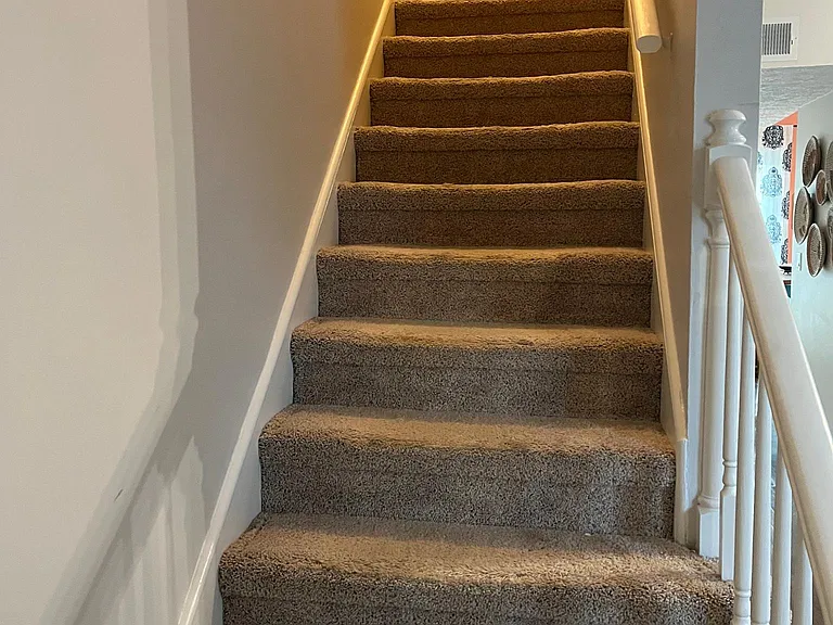 Stairs, located by front door.