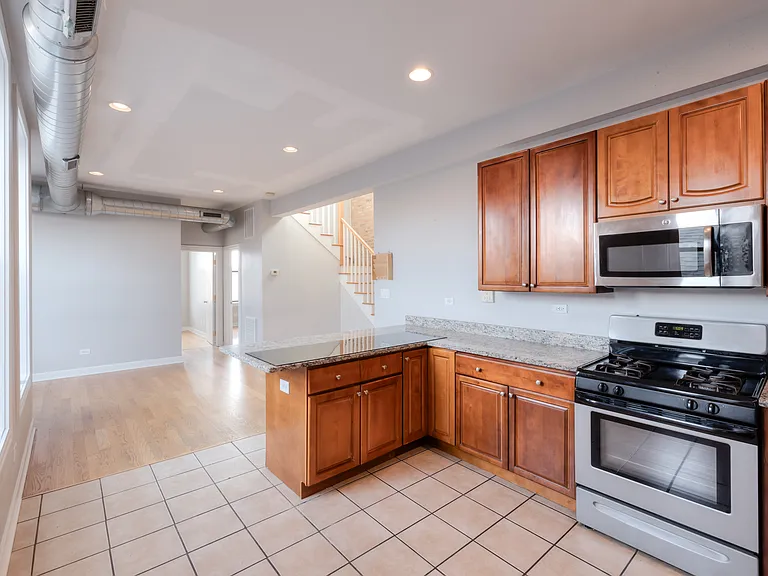 HUGE Kitchen with breakfast bar overlooking the living room