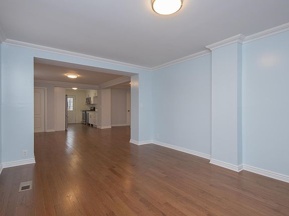 Central air conditioning and all custom painted throughout! The apt takes up the entire length of the downstairs left side and its in a lovely 2 family house!