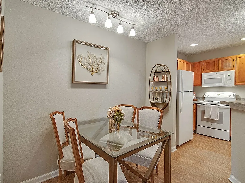 Dining area with hardwood-style flooring