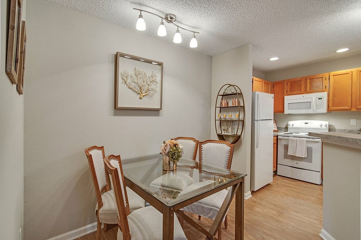 Dining area with hardwood-style flooring