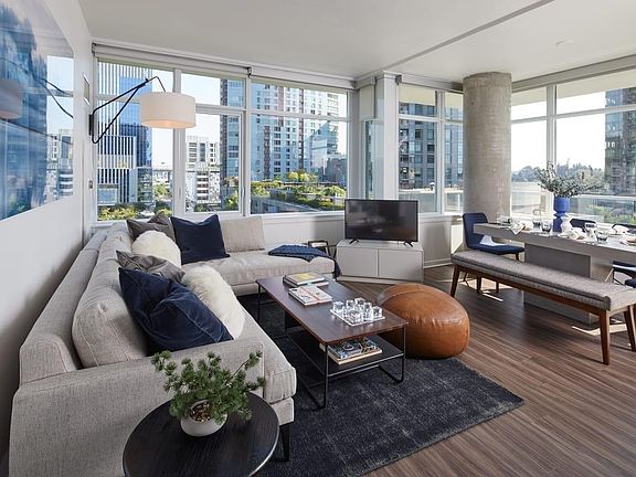 Living room with large windows and wood-style flooring