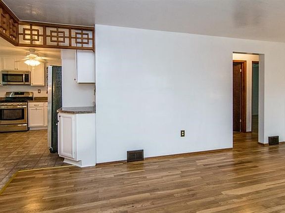 VIEW FROM LIVING ROOM INTO NEWLY UPDATED KITCHEN