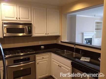 Kitchen
						:
						Granite counter tops and stainless steel appliances. In suite washer/ dryer