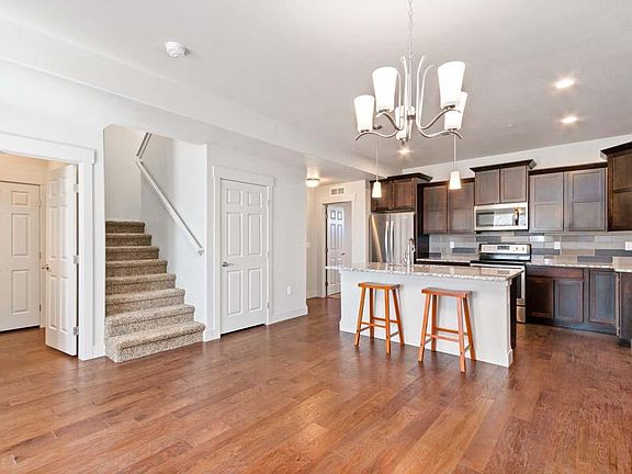 Island Kitchen with Ground Floor Master, 2 bedrooms Upstairs, 1/2 Bath to Great Room.