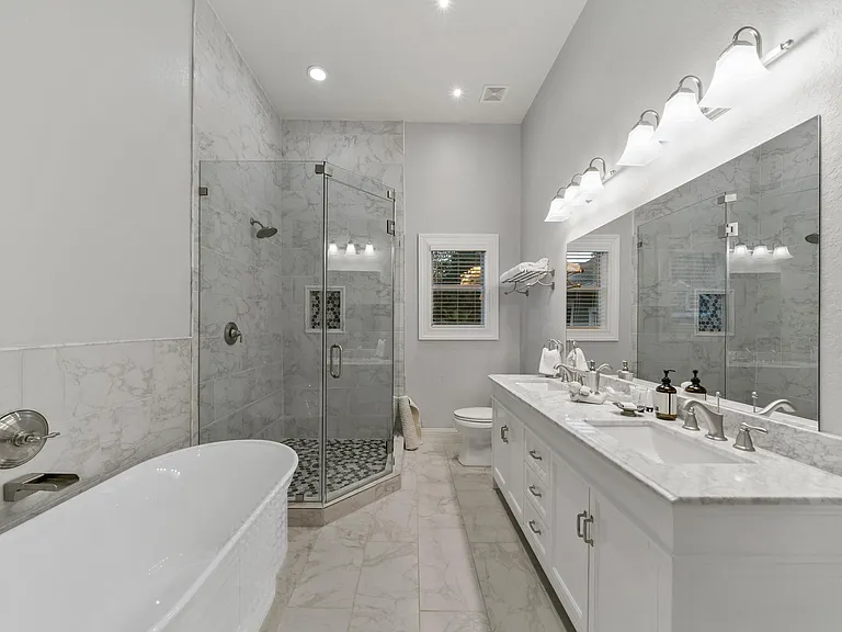 Pamper yourself every day in our exquisite marbled master bath adjacent to a huge walk-in closet with built-in storage.