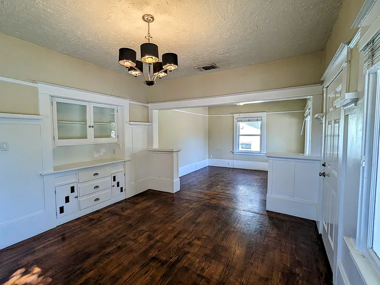 Original wood floors and built in cabinetry retain period charm and elegance.