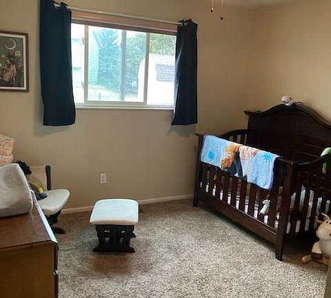 One of three bedrooms upstairs. All upstairs bedrooms have ceiling fans.