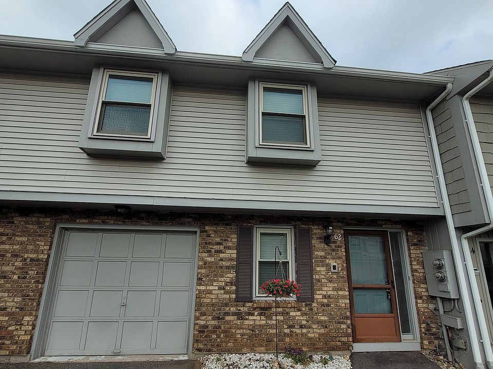 Front view of 62 Butternut Ln - double wide parking, attached garage, inviting entry
